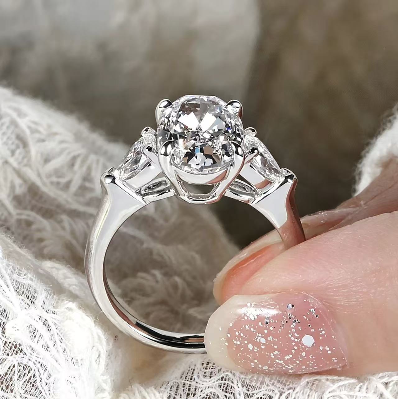 Oval shaped three stone design