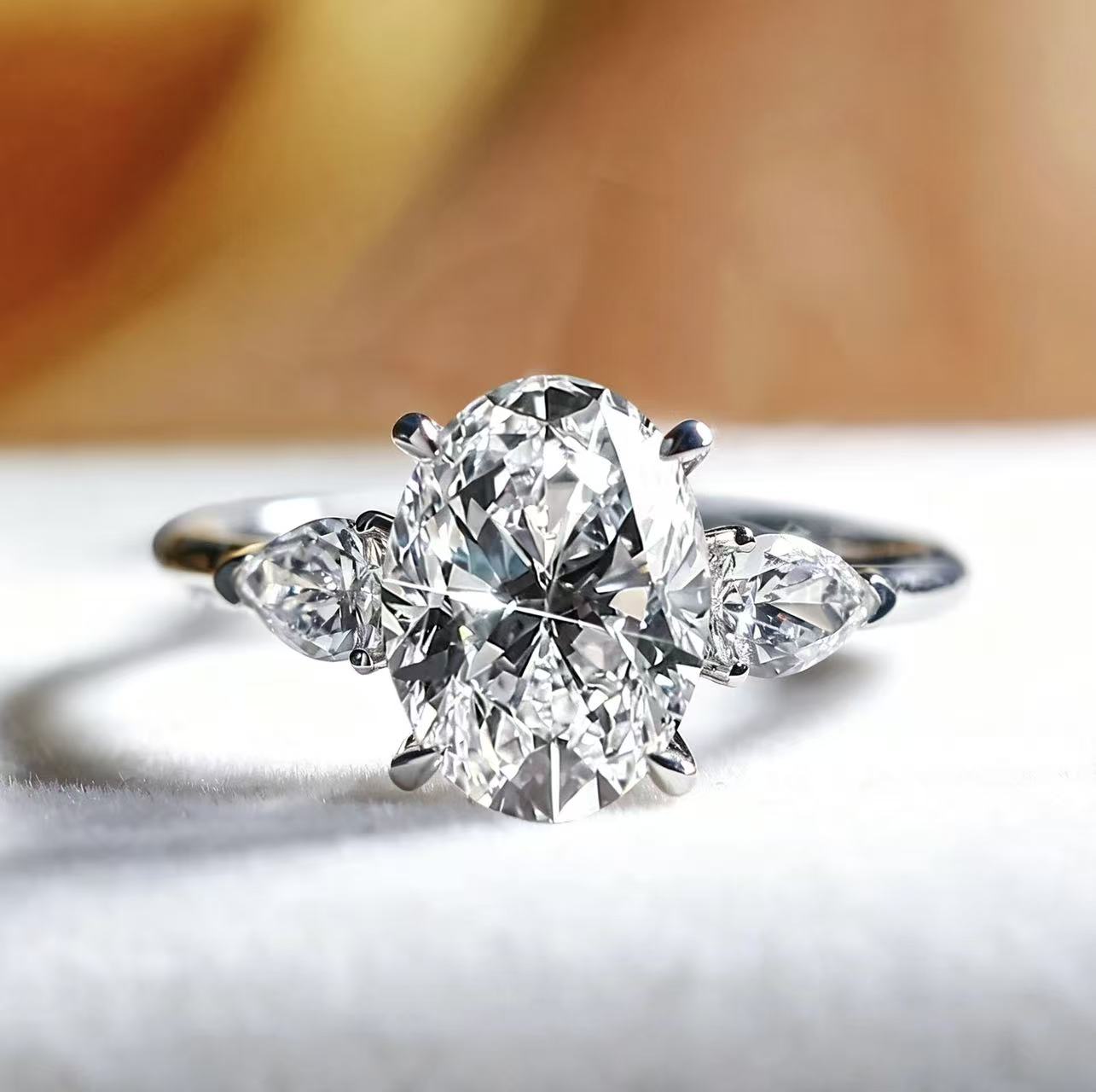 Oval shaped three stone design