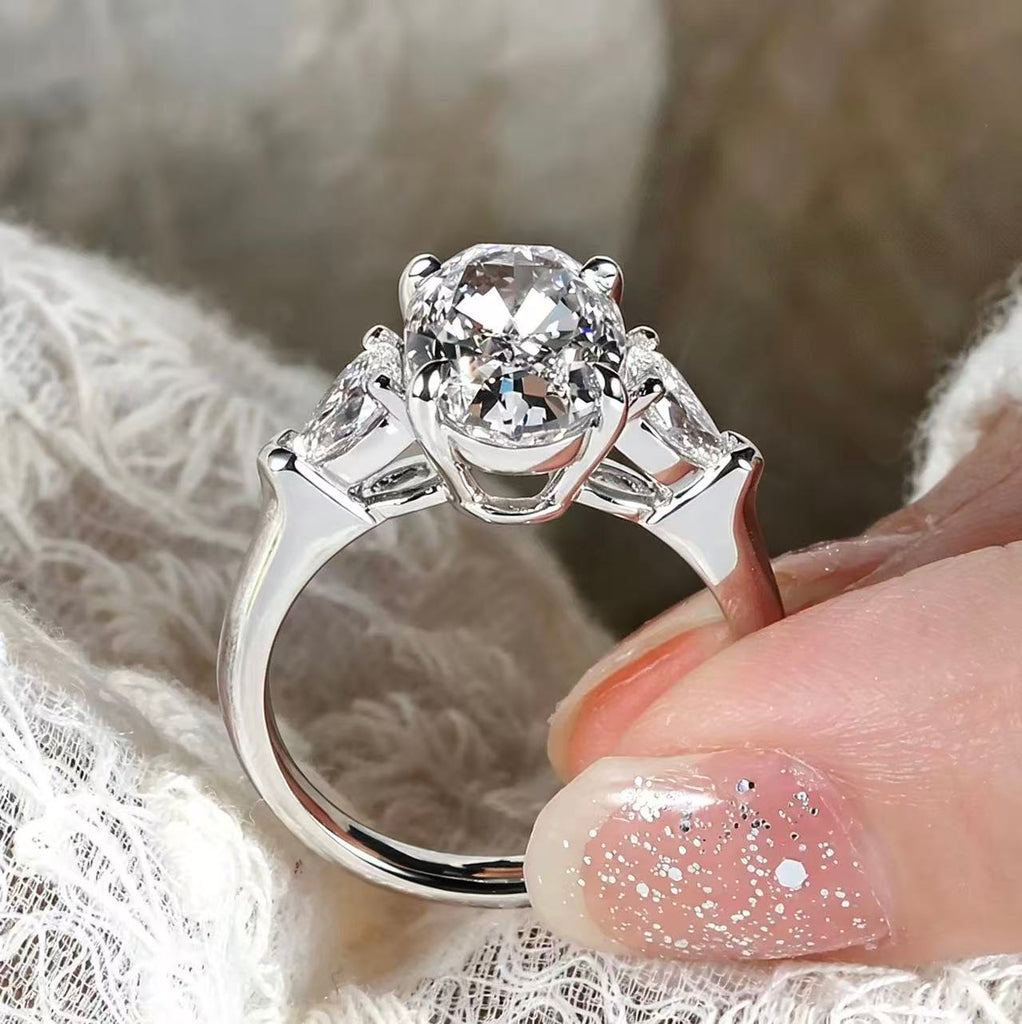 Oval shaped three stone design